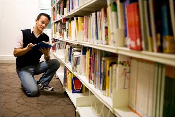 Teenage boy in library