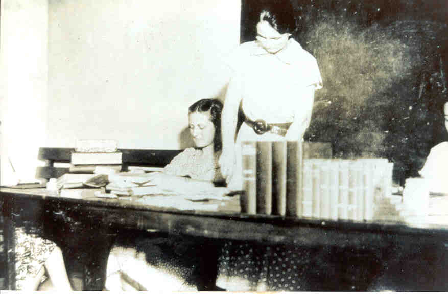 Workers rebinding books