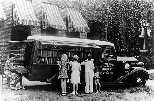 Children Reading Beside Bookmobile